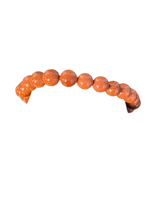 Red Goldstone Beaded Bracelet with shimmering red beads for motivation and style.