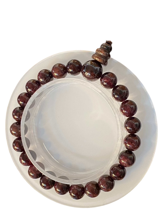 Garnet Mala Beaded Bracelet with deep red garnet beads on a white background.