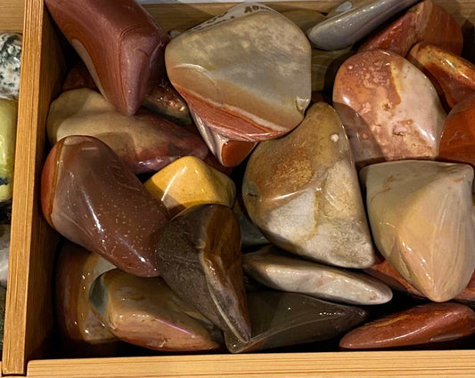 Large tumbled Desert Jasper stones in various colors, showcasing natural vitality and strength.