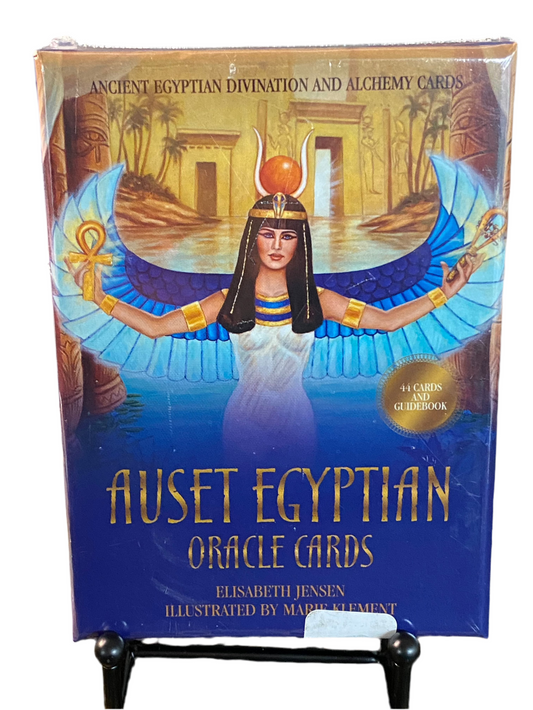 Auset Egyptian Oracle Cards deck with mystical imagery and guidebook.