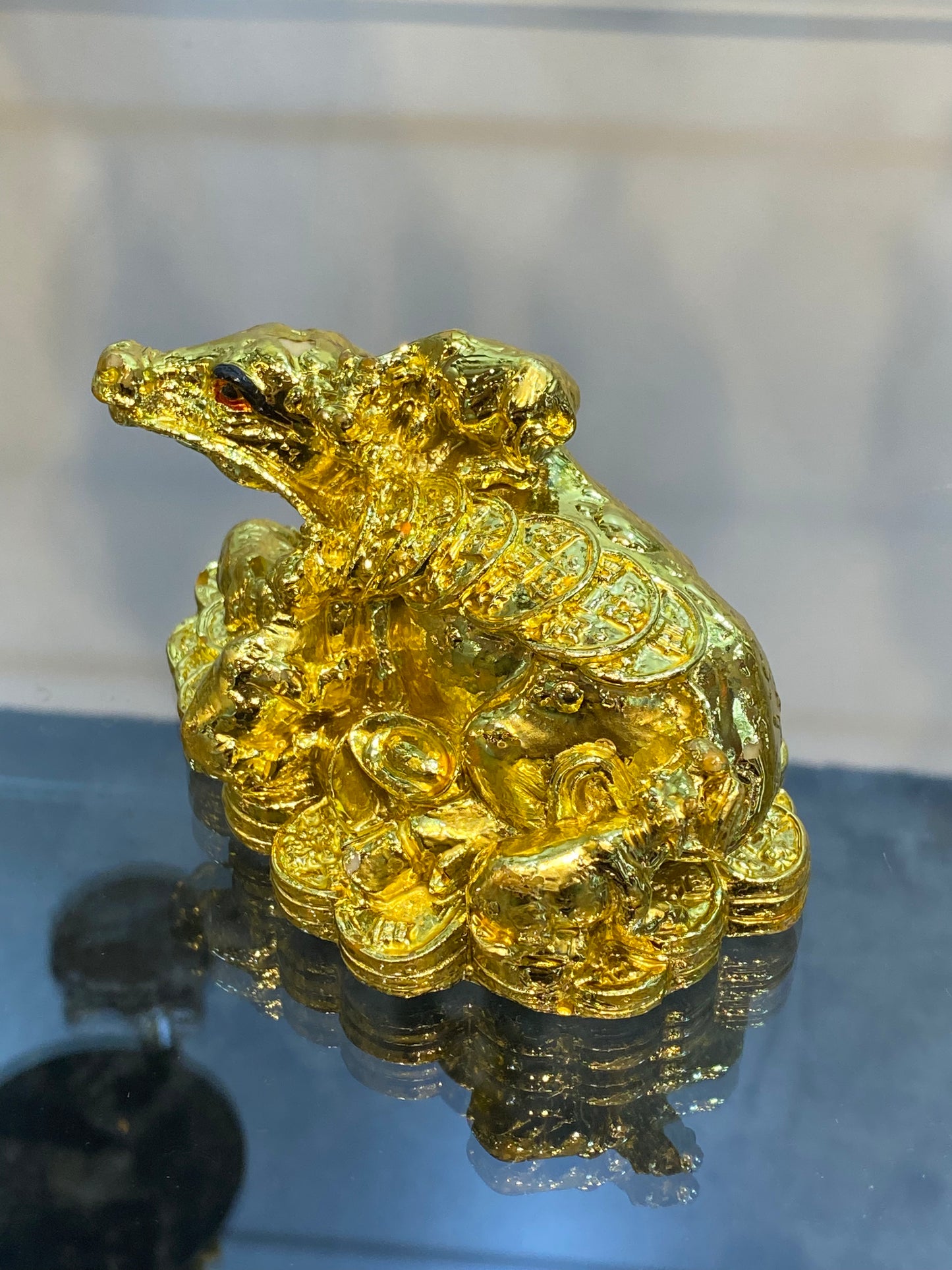 Feng Shui Shiny Gold Colored Money Ox With Baby Ox sitting on Coins