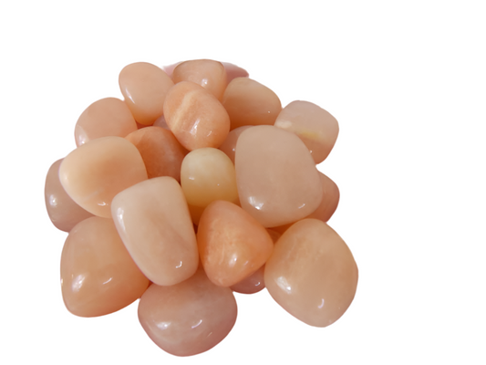 Peach Moonstone tumbled stones for emotional balance and inner peace.