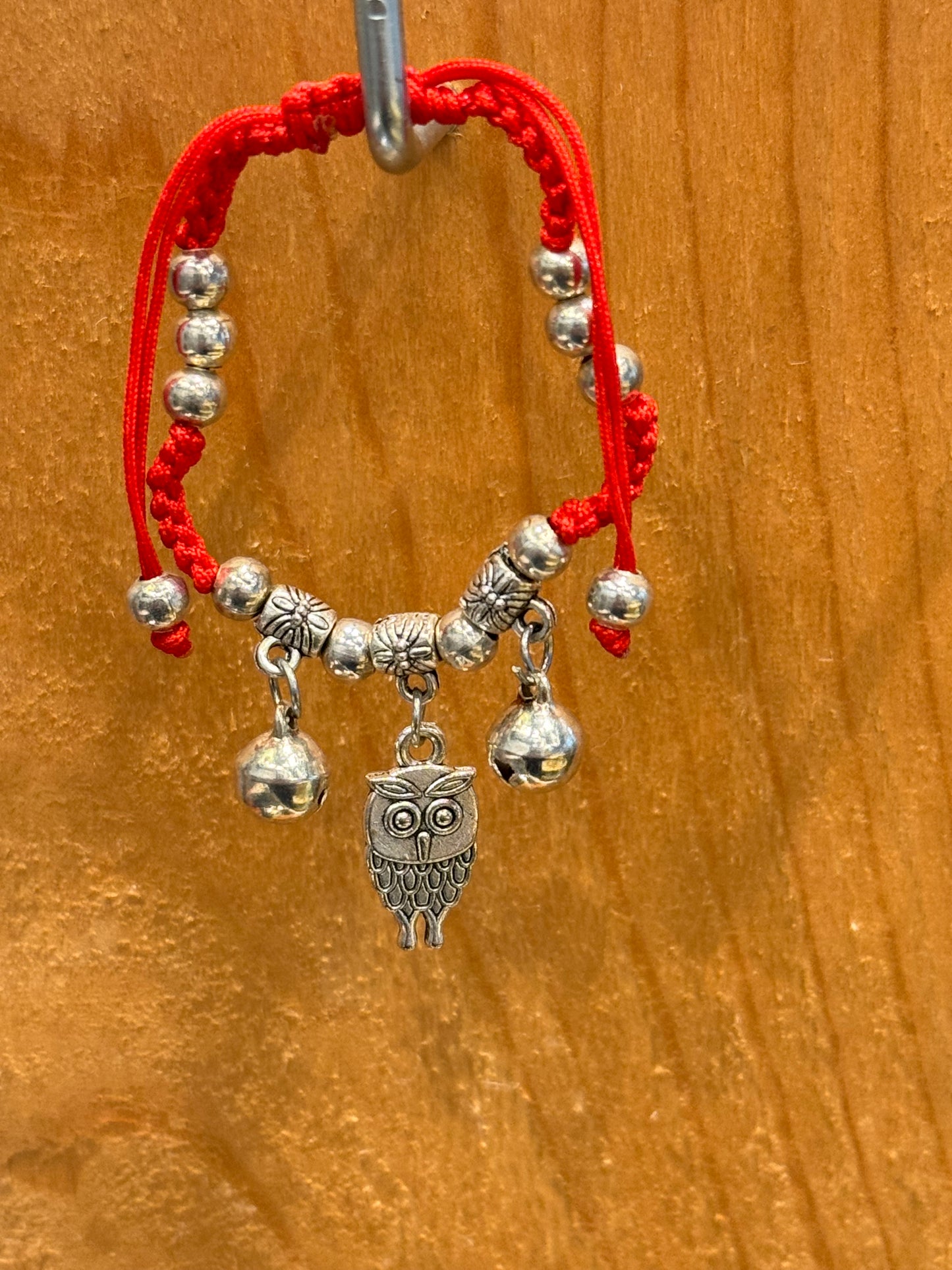 Red String Braided Pull Tie Bracelet with Silver Beads, Bells and Owl Charm