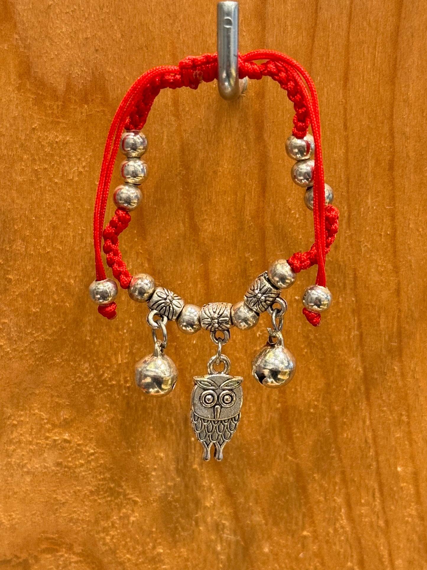 Red String Braided Pull Tie Bracelet with Silver Beads, Bells and Owl Charm