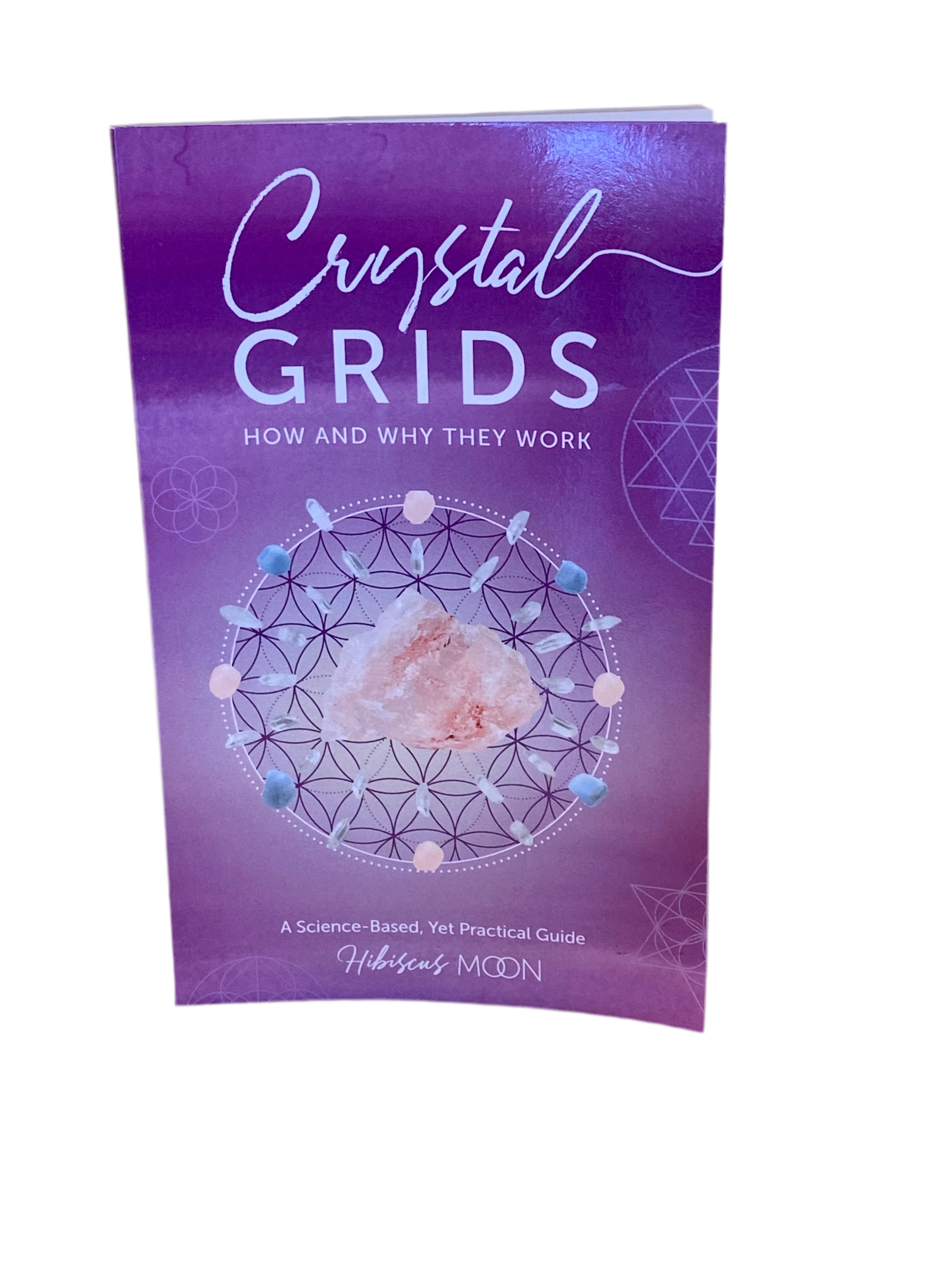 Crystal Grids Book cover featuring sacred geometry and crystals by Hibiscus Moon.