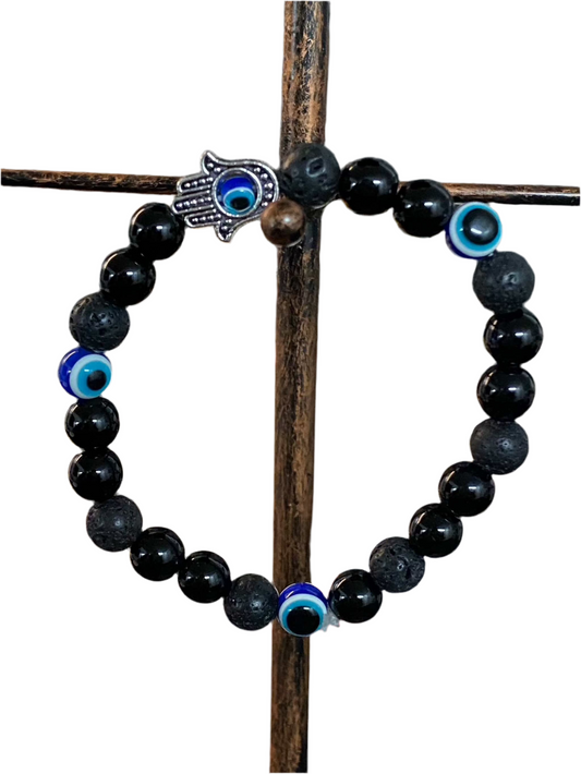 Black Obsidian Lava Rock Evil Eye Bracelet with Hamsa charm featuring black beads.