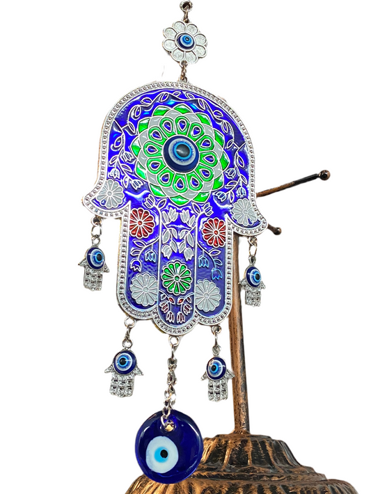Blue Hand of Fatima talisman with green, red, and white flower accents for protection and good fortune.