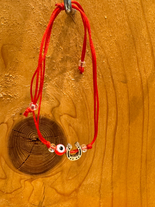 Red String Pull Tie Bracelet With Horseshoe Charm and Evil Eye Bead