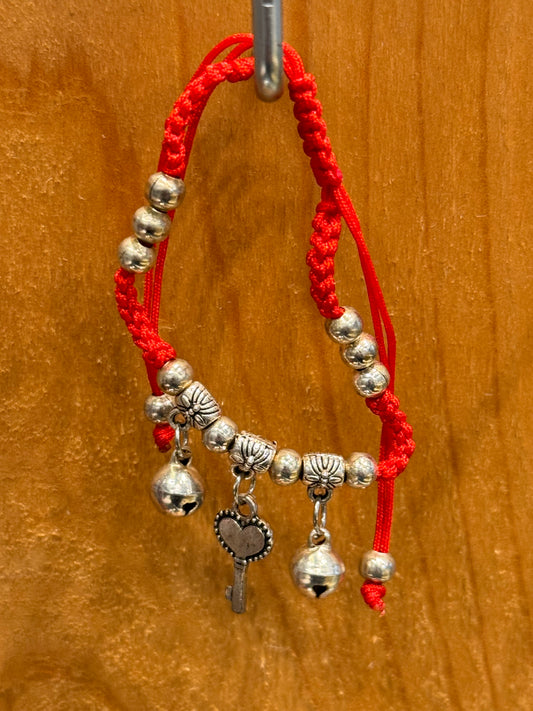Red String Braided Pull Tie Bracelet with Silver Beads, Bells and Key Charm