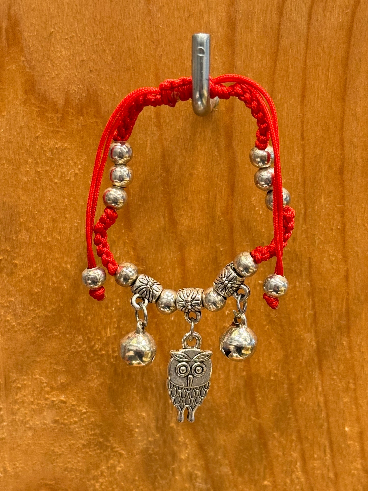 Red String Braided Pull Tie Bracelet with Silver Beads, Bells and Owl Charm