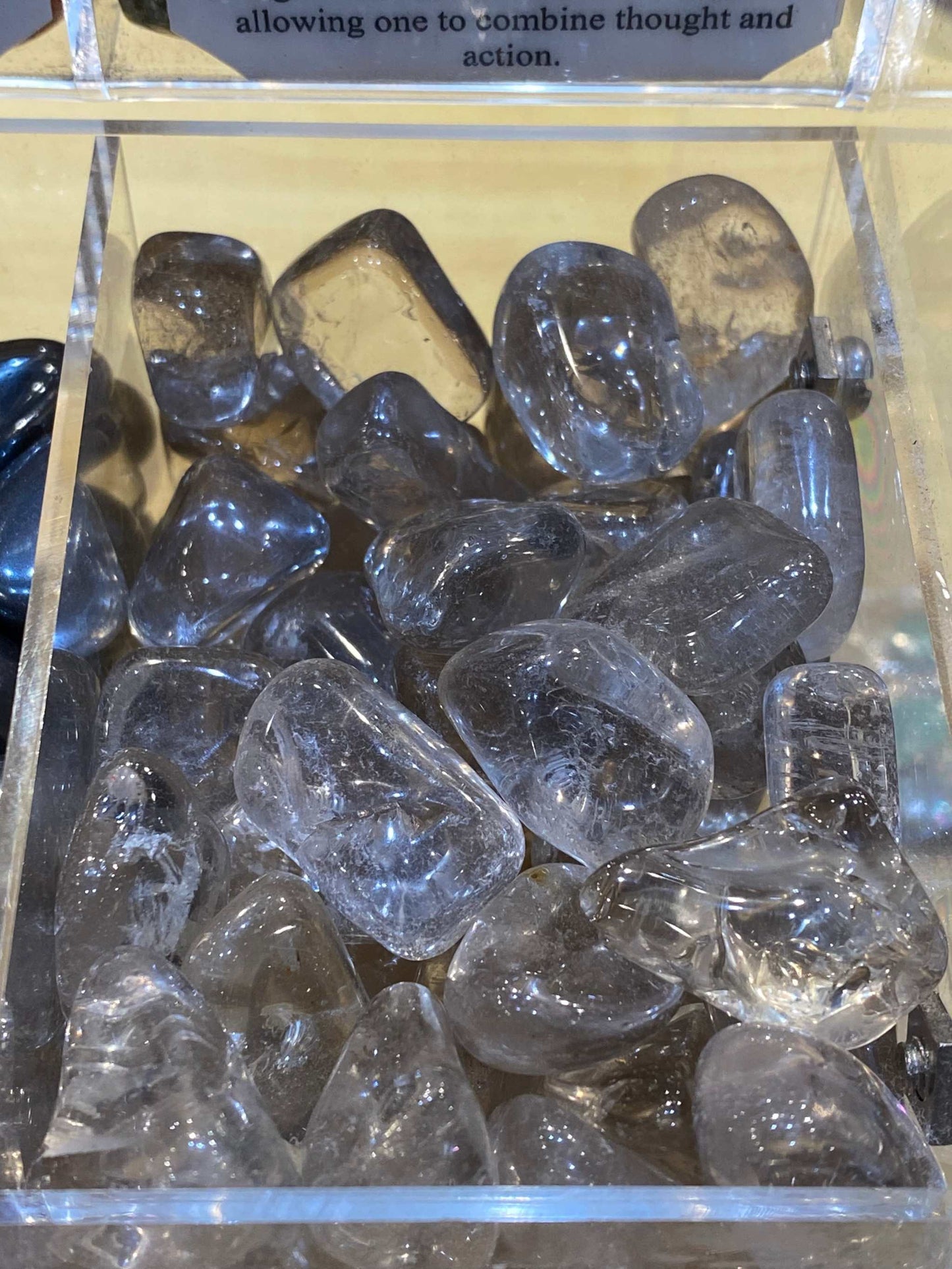 Smoky Quartz Crystal in a display case, emphasizing focus, grounding, and calm.