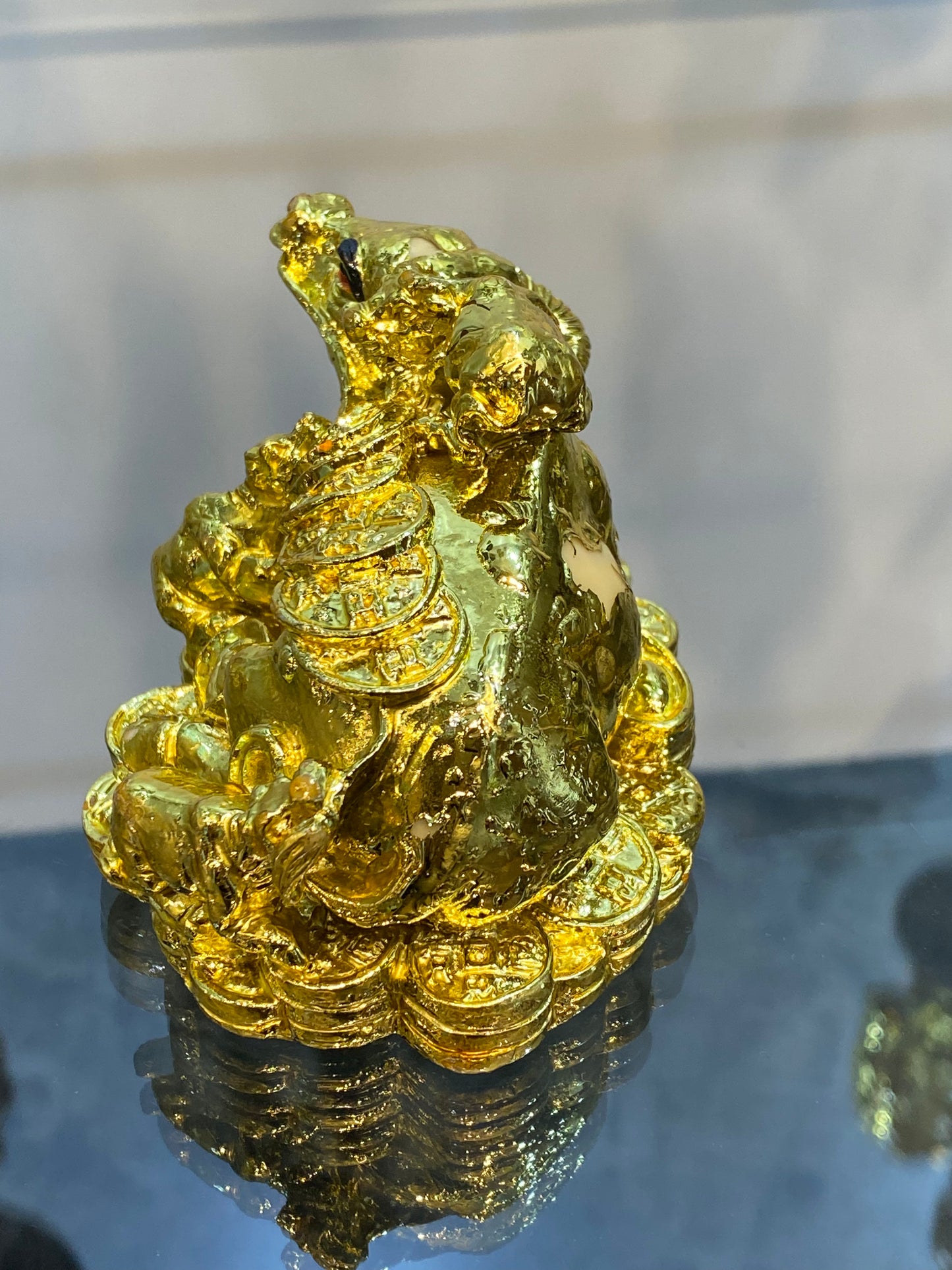 Feng Shui Shiny Gold Colored Money Ox With Baby Ox sitting on Coins