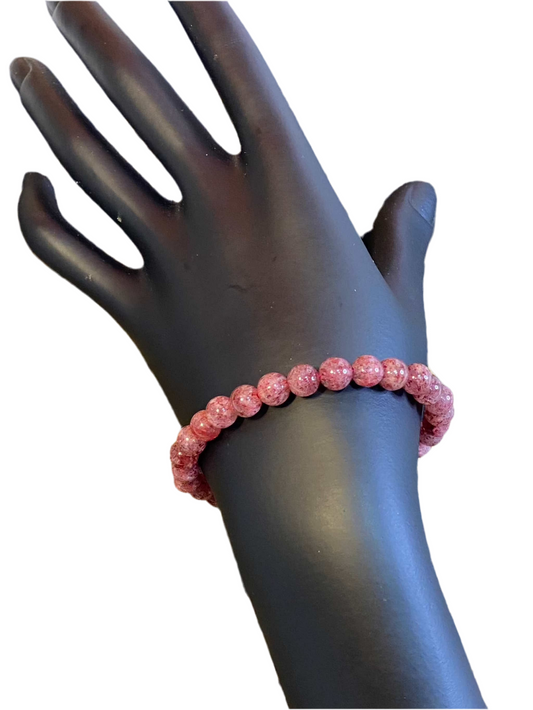 Strawberry Quartz Beaded String Bracelet on mannequin hand, promoting awareness and energy.