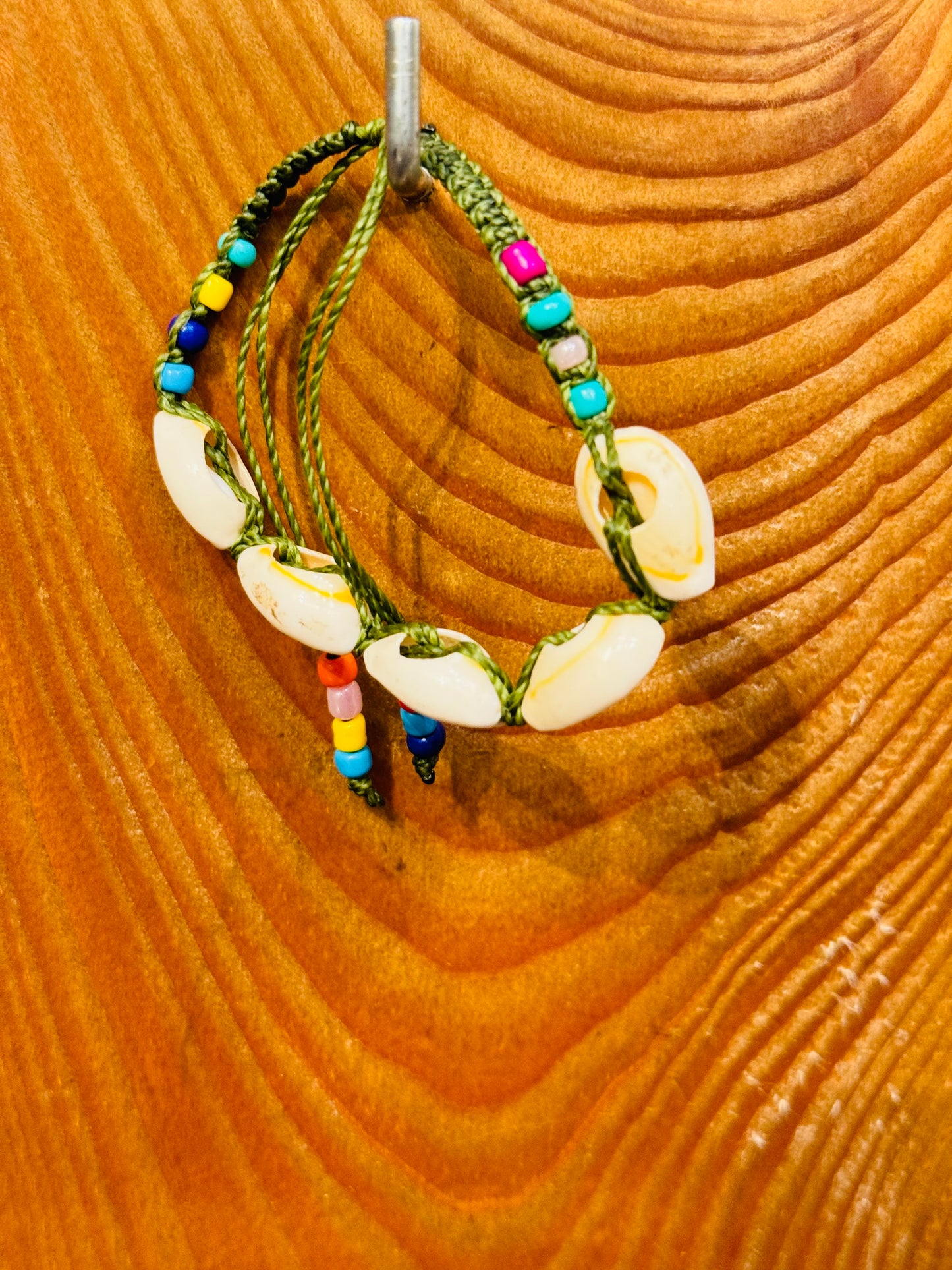 Handmade Army Green String Bracelet With Cowrie Shells and Colorful Beads “Boho charm meets ocean energy — wear abundance on your wrist.”