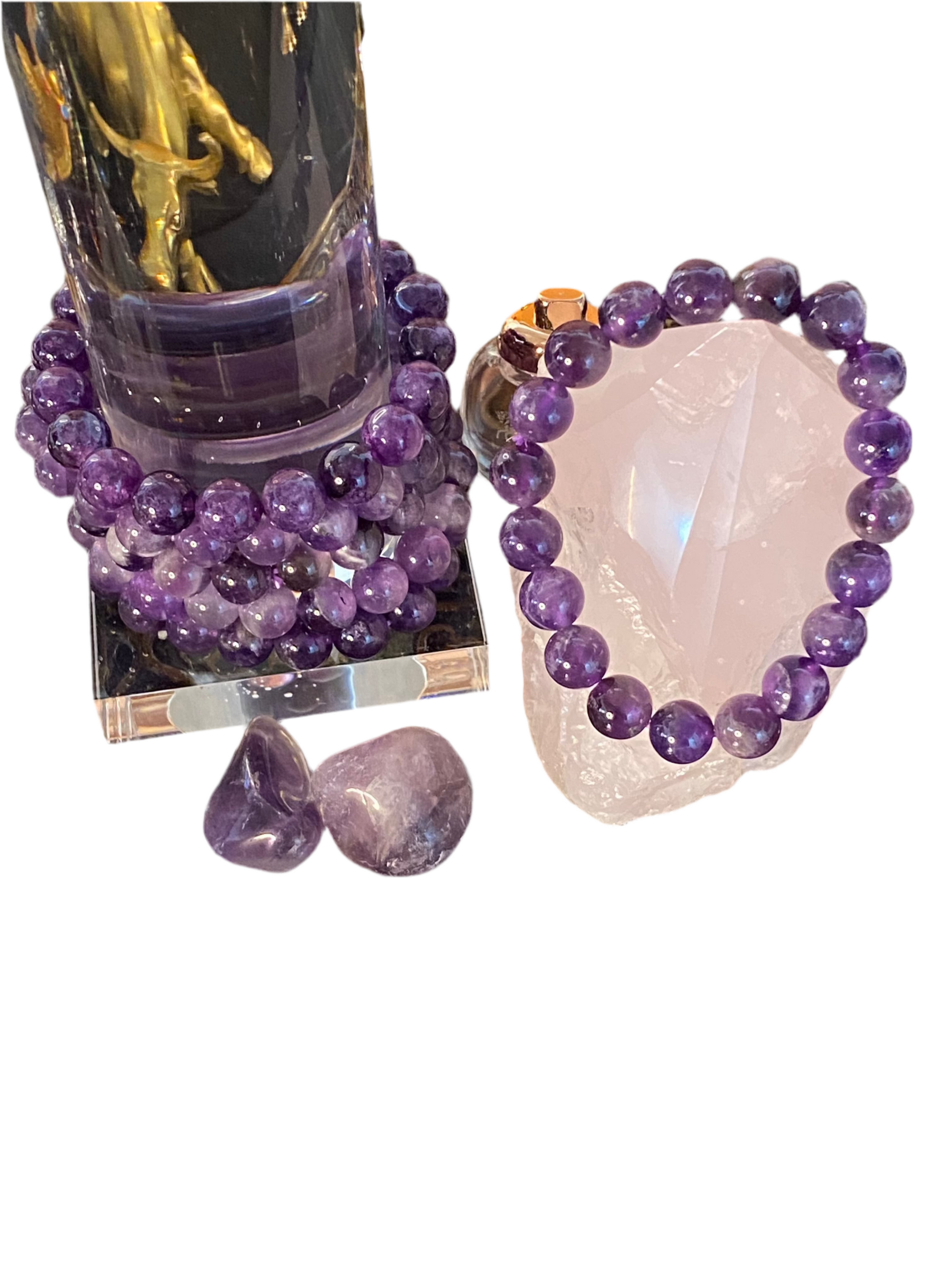 Amethyst Gemstone Bracelet 10mm with deep purple beads displayed with crystals.