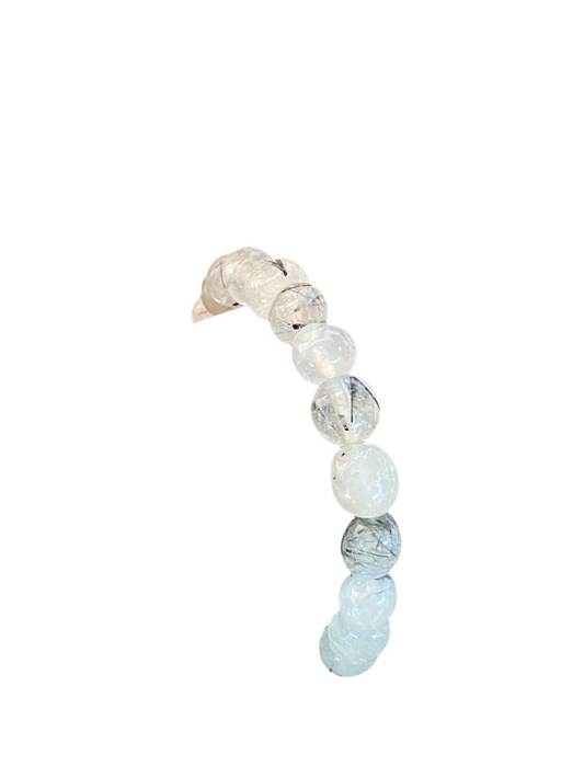 Tourmalated Quartz with clear and black inclusions on a bracelet.