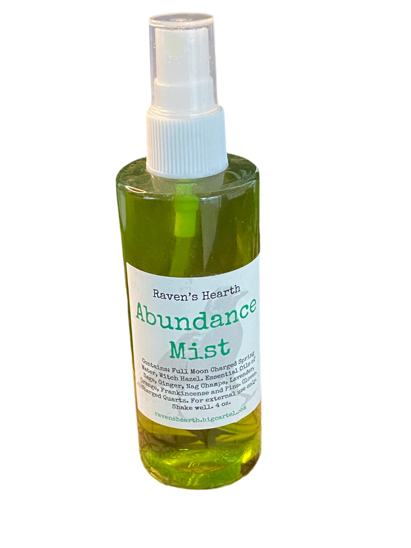 Abundance Mist Room Spray bottle with green liquid and label, promoting prosperity and positive energy.