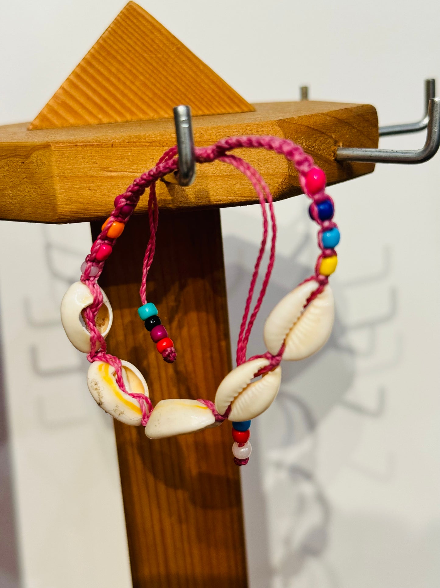 Handmade Pink String Bracelet With Cowrie Shells and Colorful Beads. Bright, joyful, and filled with ocean energy.