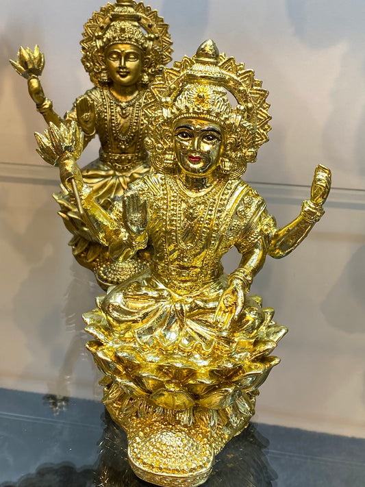 Goddess Lakshmi on Lotus Raining Gold Coins Bright Golden Color