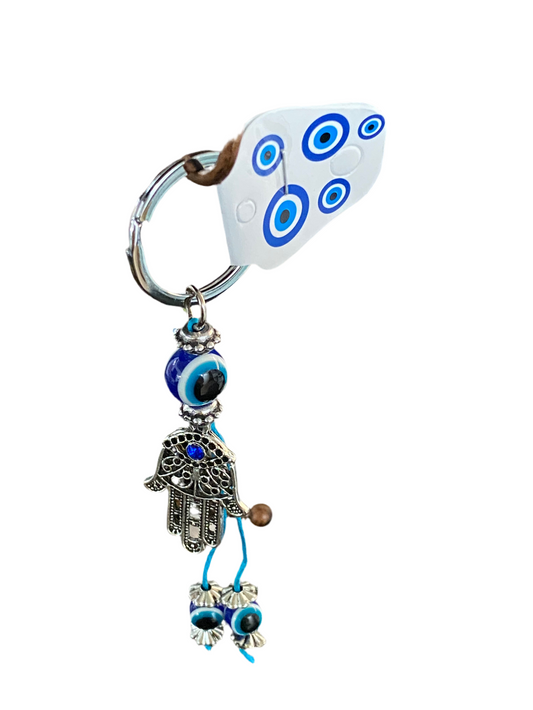 Hamsa Evil Eye Keychain with intricate design for protection and style.