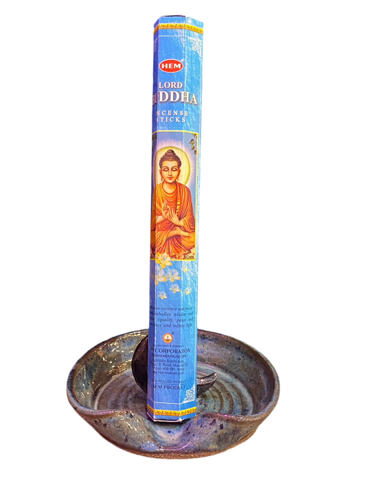 HEM Lord Buddha Incense Sticks in decorative holder for tranquility and meditation.