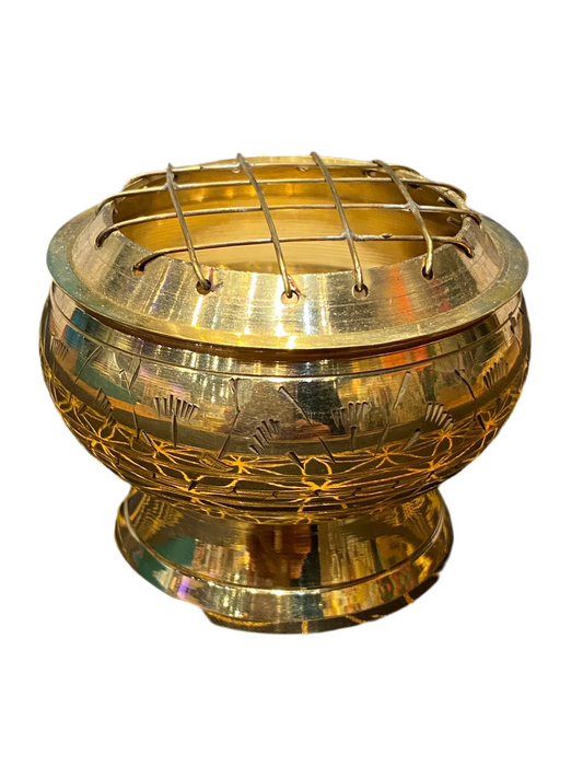 Large gold brass charcoal burner with intricate flower engraving and grid.