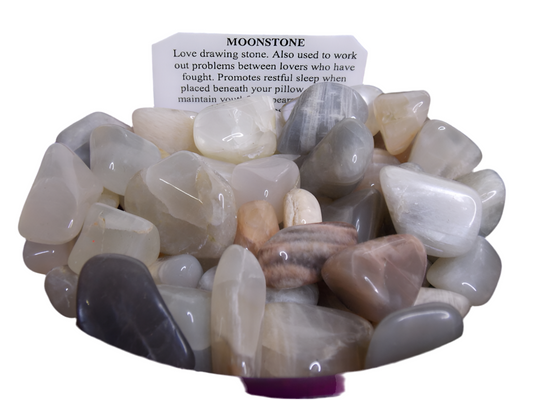 Moonstone crystal, dime size, enhances intuition and sensuality, promotes safe travel.