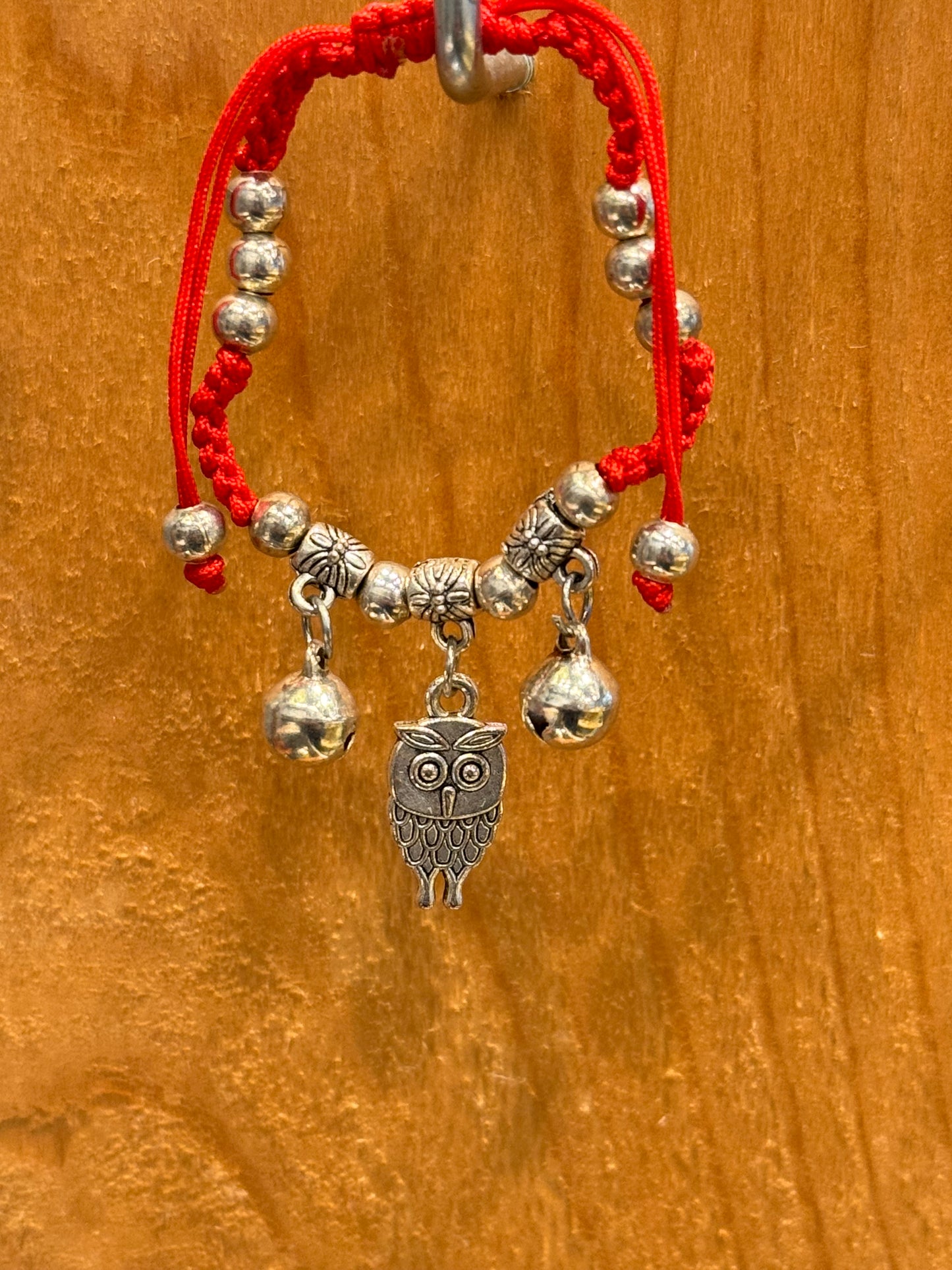 Red String Braided Pull Tie Bracelet with Silver Beads, Bells and Owl Charm