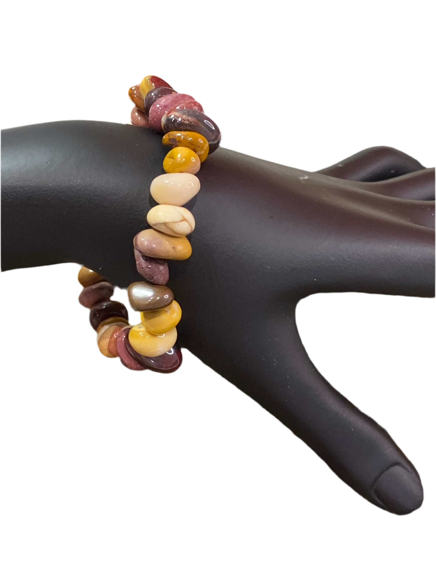 Mookaite Jasper Tumbled Beaded Bracelet showcasing earthy hues on a black display hand.