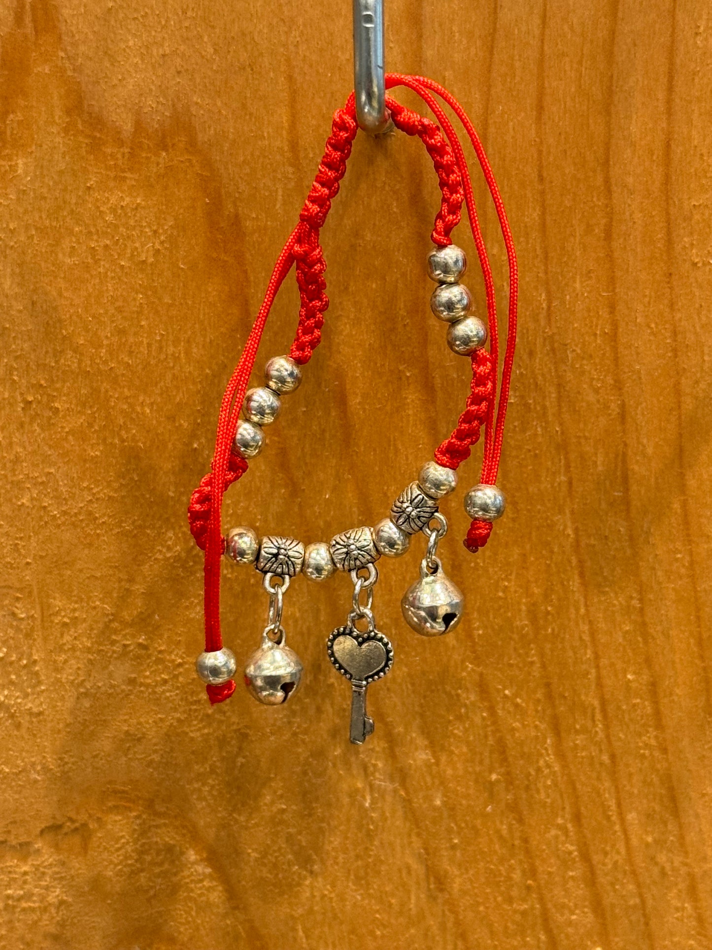 Red String Braided Pull Tie Bracelet with Silver Beads, Bells and Key Charm