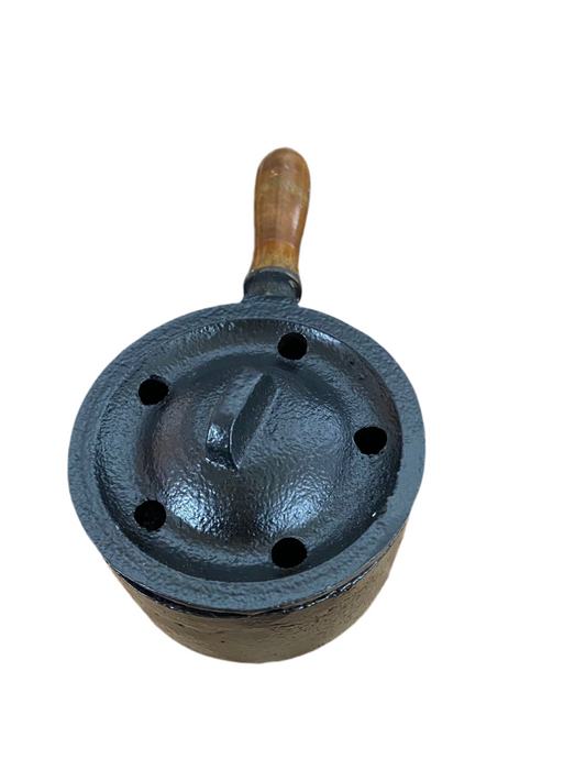 small cast iron cauldron with lid and wooden handle for rituals and ceremonies
