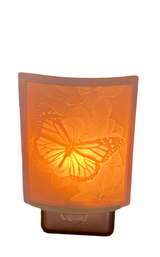 Butterfly Lithophane Night Light emitting warm glow, crafted from porcelain with detailed butterfly design.