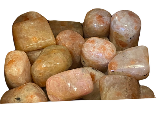 Sunstone tumbled stones showcasing warm hues, symbolizing leadership and generosity.