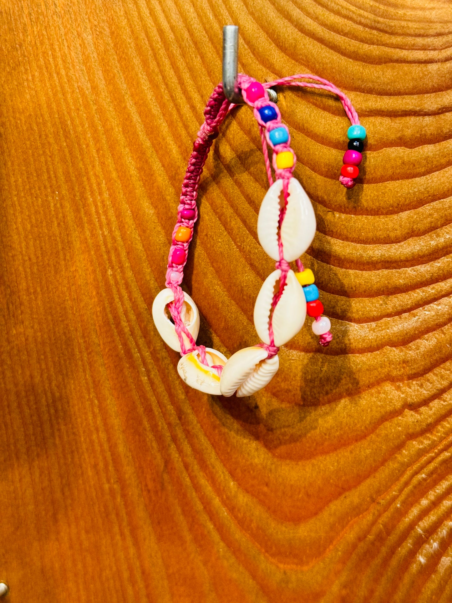 Handmade Pink String Bracelet With Cowrie Shells and Colorful Beads. Bright, joyful, and filled with ocean energy.