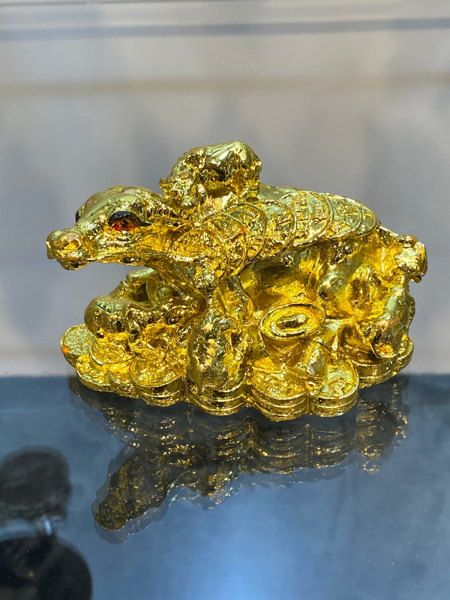 Feng Shui Shiny Gold Colored Money Ox With Baby Ox sitting on Coins