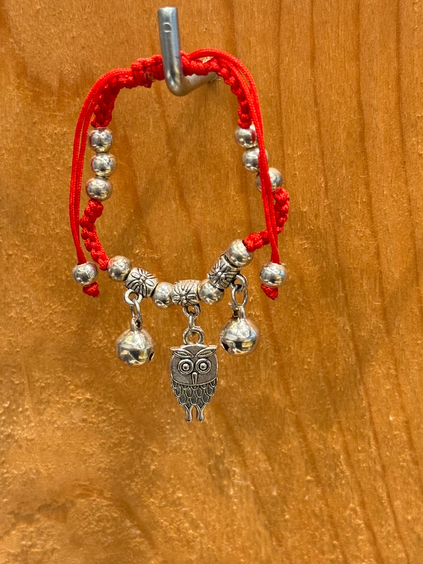 Red String Braided Pull Tie Bracelet with Silver Beads, Bells and Owl Charm