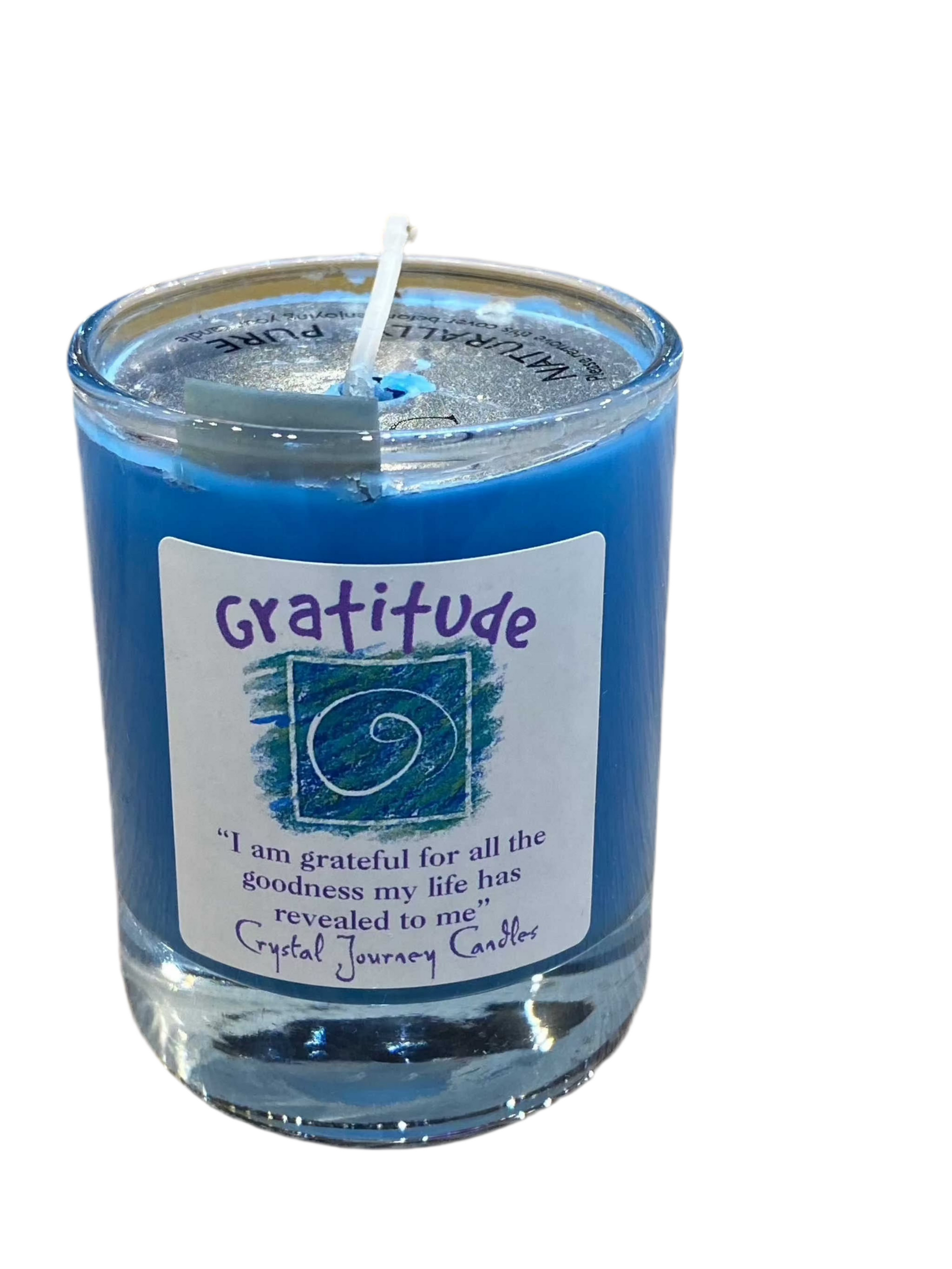 Gratitude Crystal Journey Filled Glass Votive with lavender, musk, clove, and cedar essential oils.