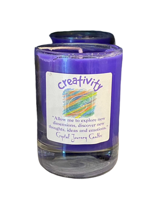 Creativity Crystal Journey Filled Glass Votive candle with scents of Iris, Rose, and Cinnamon.