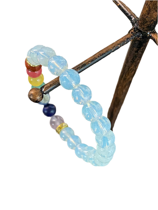 Opalite Chakra Gemstone Bracelet with luminous blue and multicolored beads for spiritual clarity and balance.