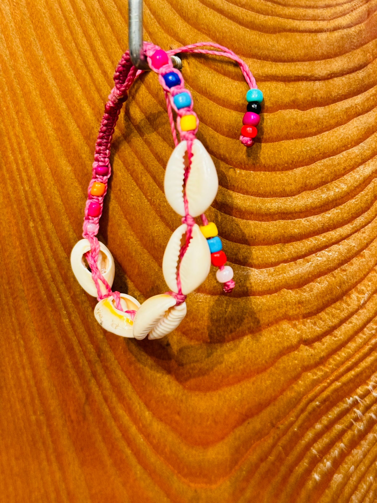 Handmade Pink String Bracelet With Cowrie Shells and Colorful Beads. Bright, joyful, and filled with ocean energy.