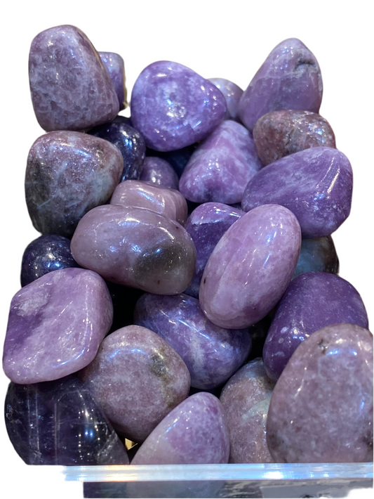 Tumbled Lepidolite stones for emotional balance and spiritual growth.