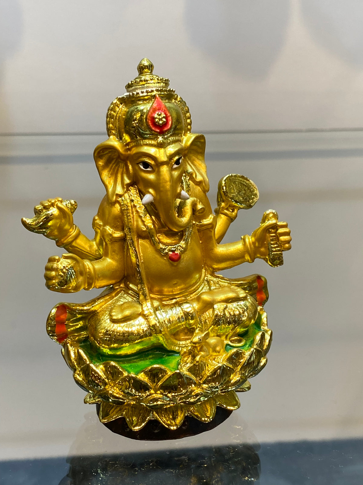 Golden Ganesha on Lotus Statue – Four-Armed Hindu Deity