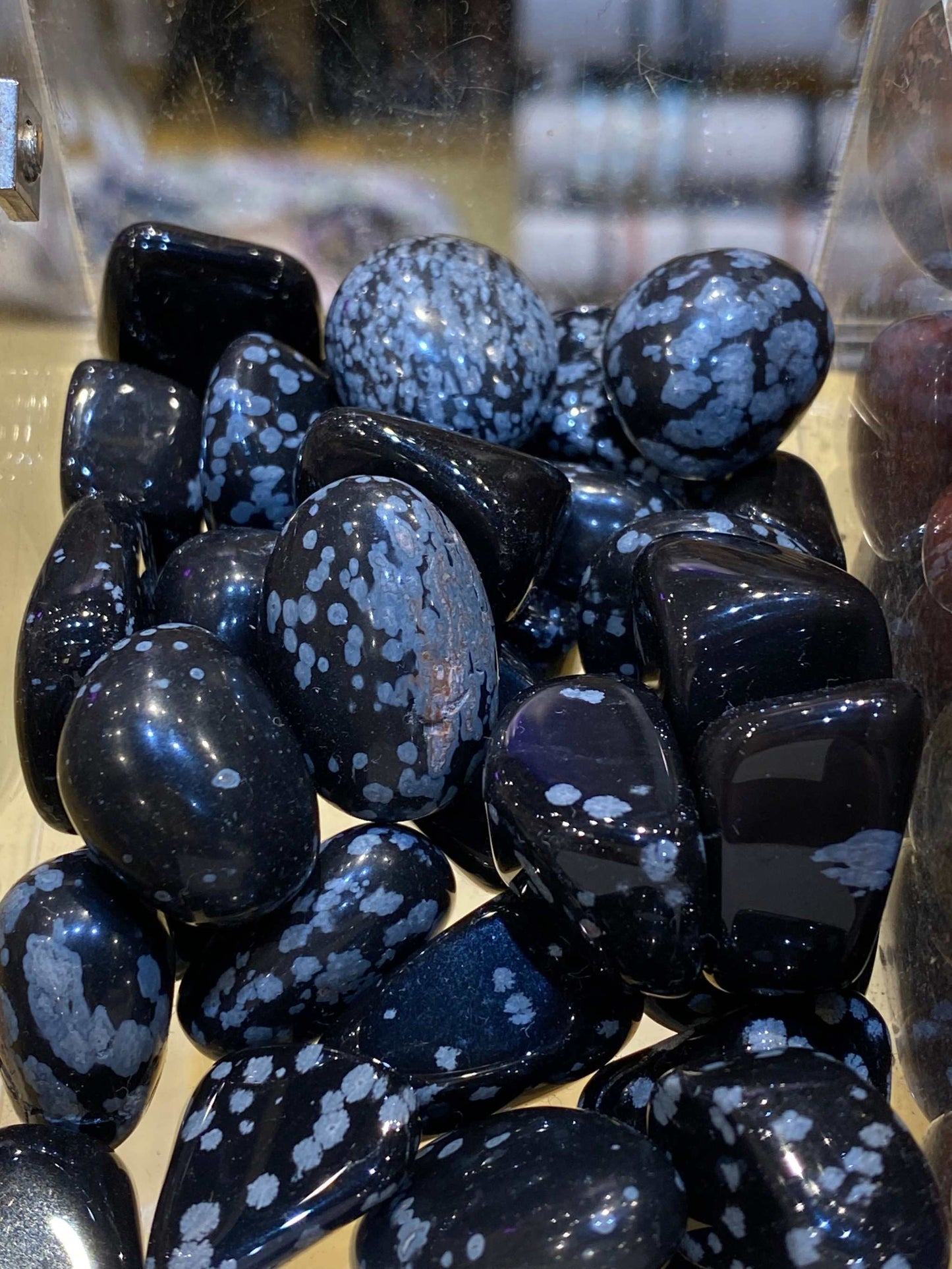 Obsidian Snowflake Tumbled Stones with unique patterns, ideal for meditation and spiritual healing.