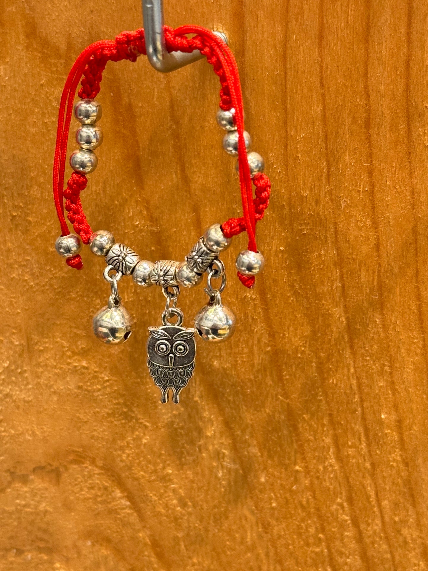 Red String Braided Pull Tie Bracelet with Silver Beads, Bells and Owl Charm