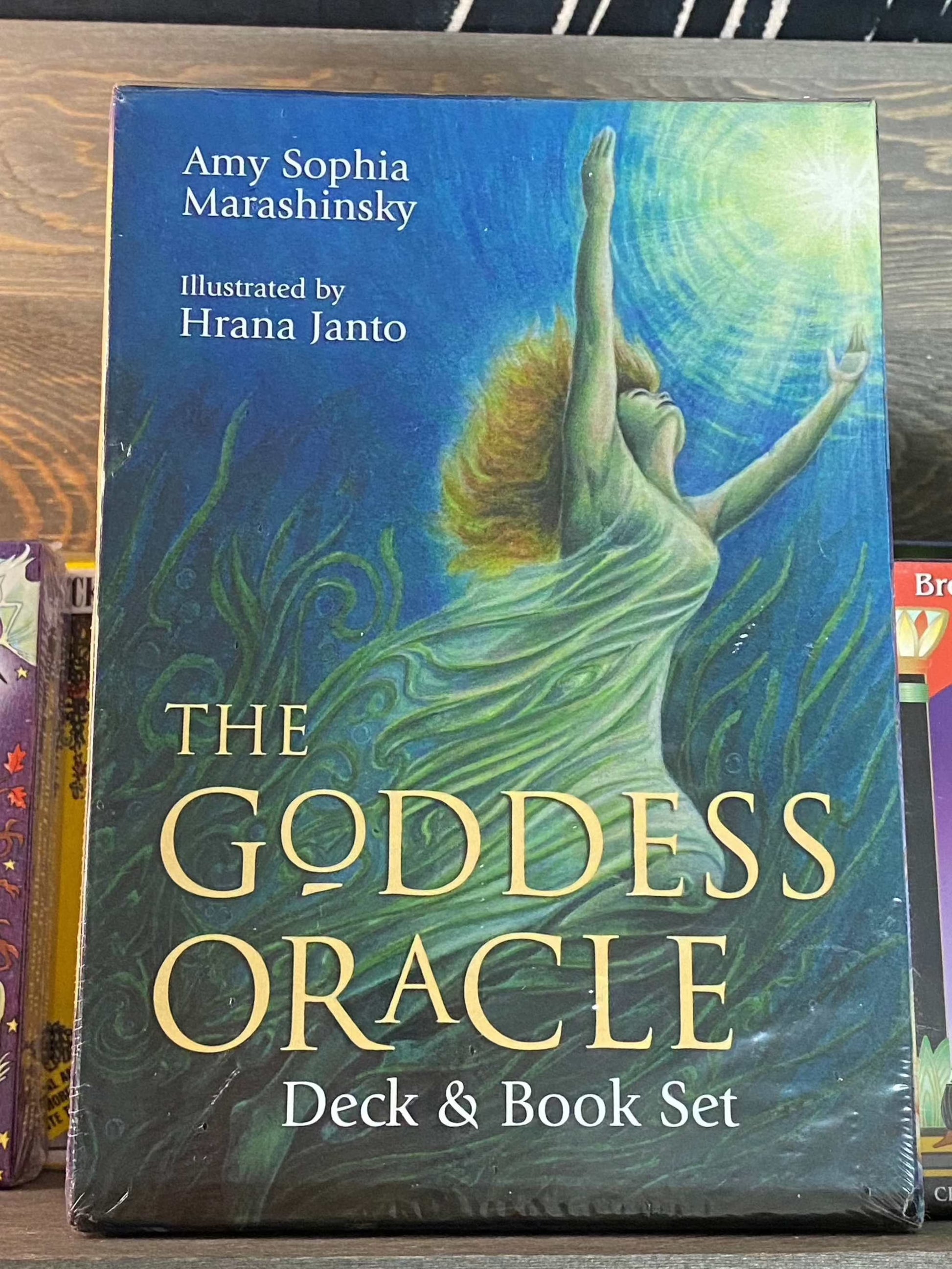 The Goddess Oracle Deck & Book Set packaging with divine feminine artwork.