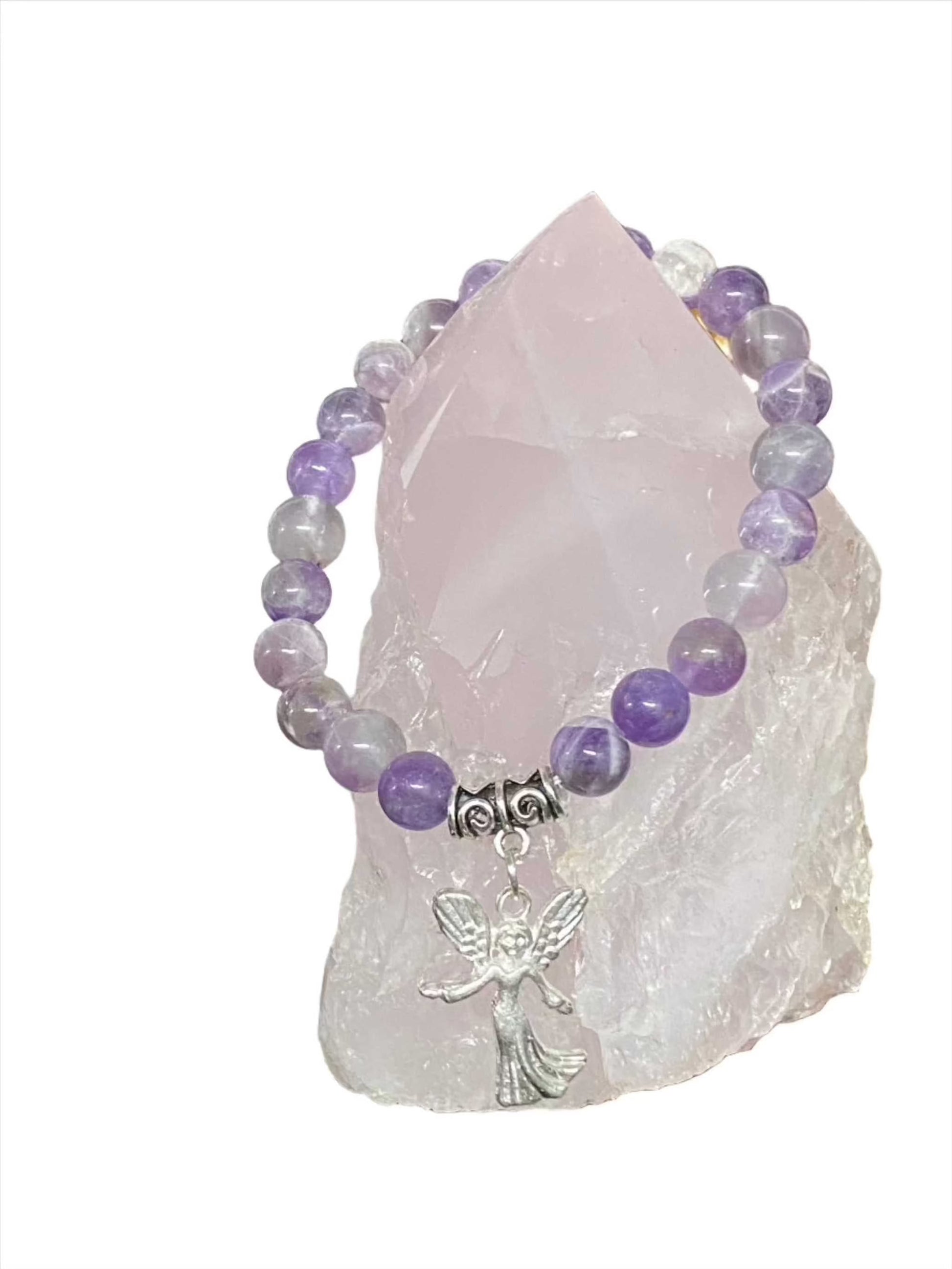 Amethyst Angel Charm Gemstone Bracelet with purple amethyst beads and silver angel charm on crystal background.