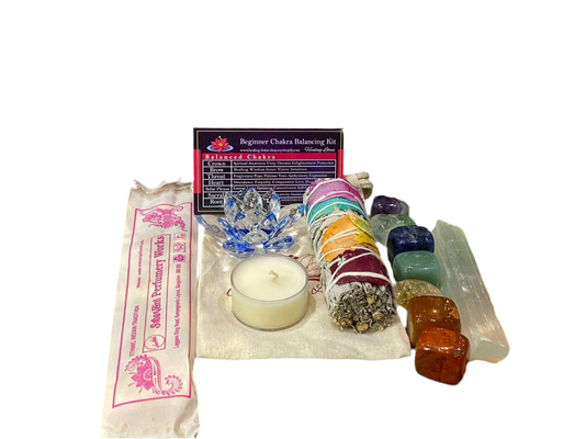 Beginner Chakra Balancing Kit with crystals, sage, candle, lotus, and information card for spiritual healing.