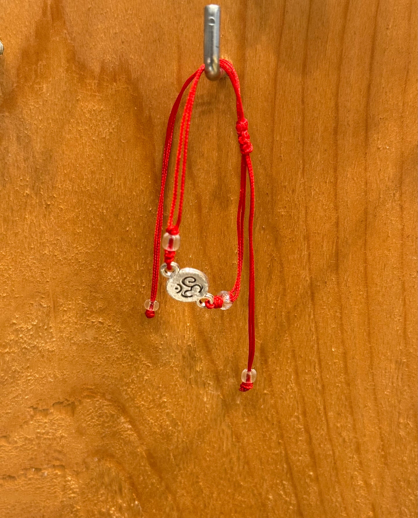 Red String Om Pull String Bracelet