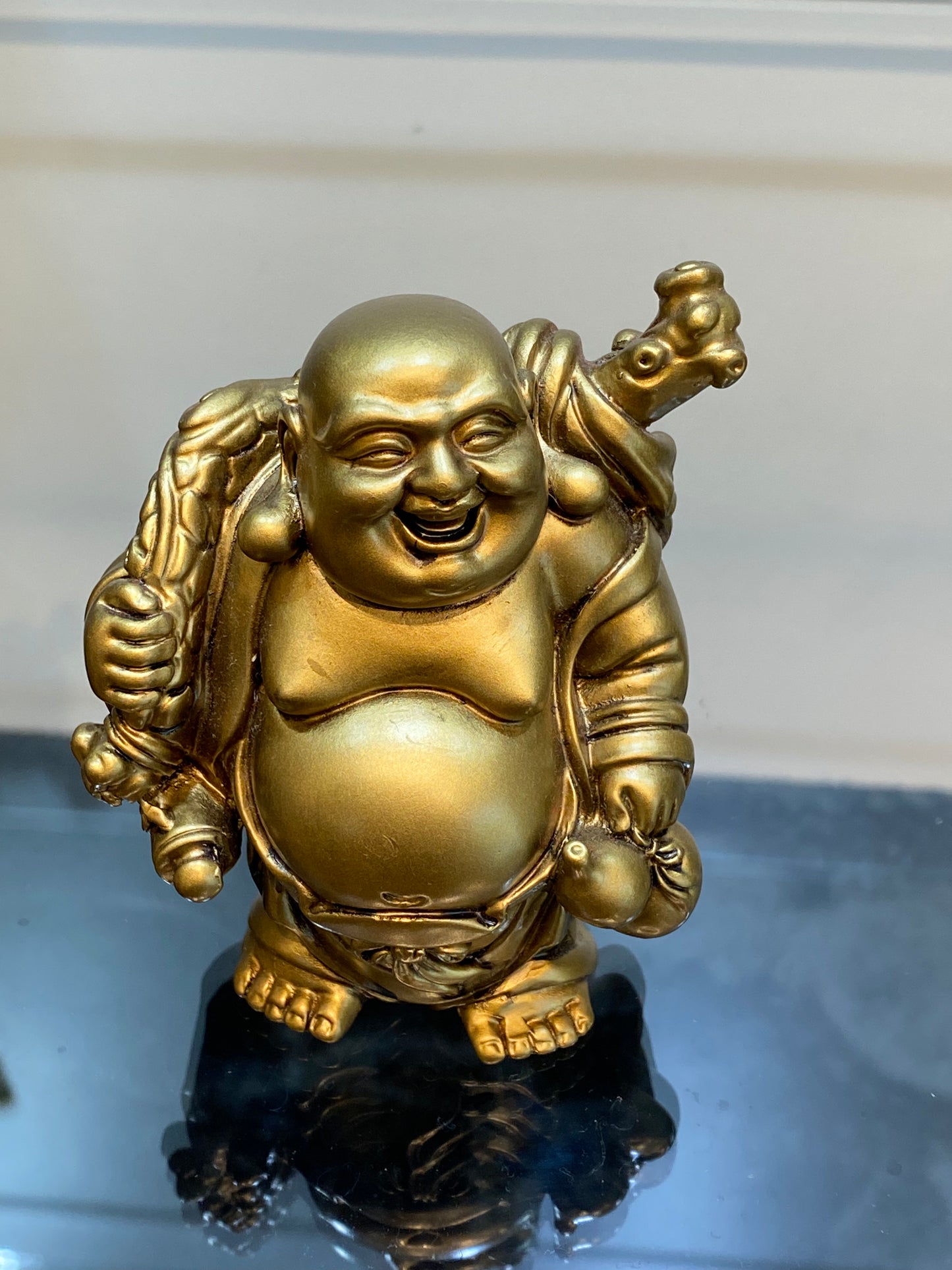 Gold Laughing Standing Buddha holding his bag of plenty and a Bottle Gourd