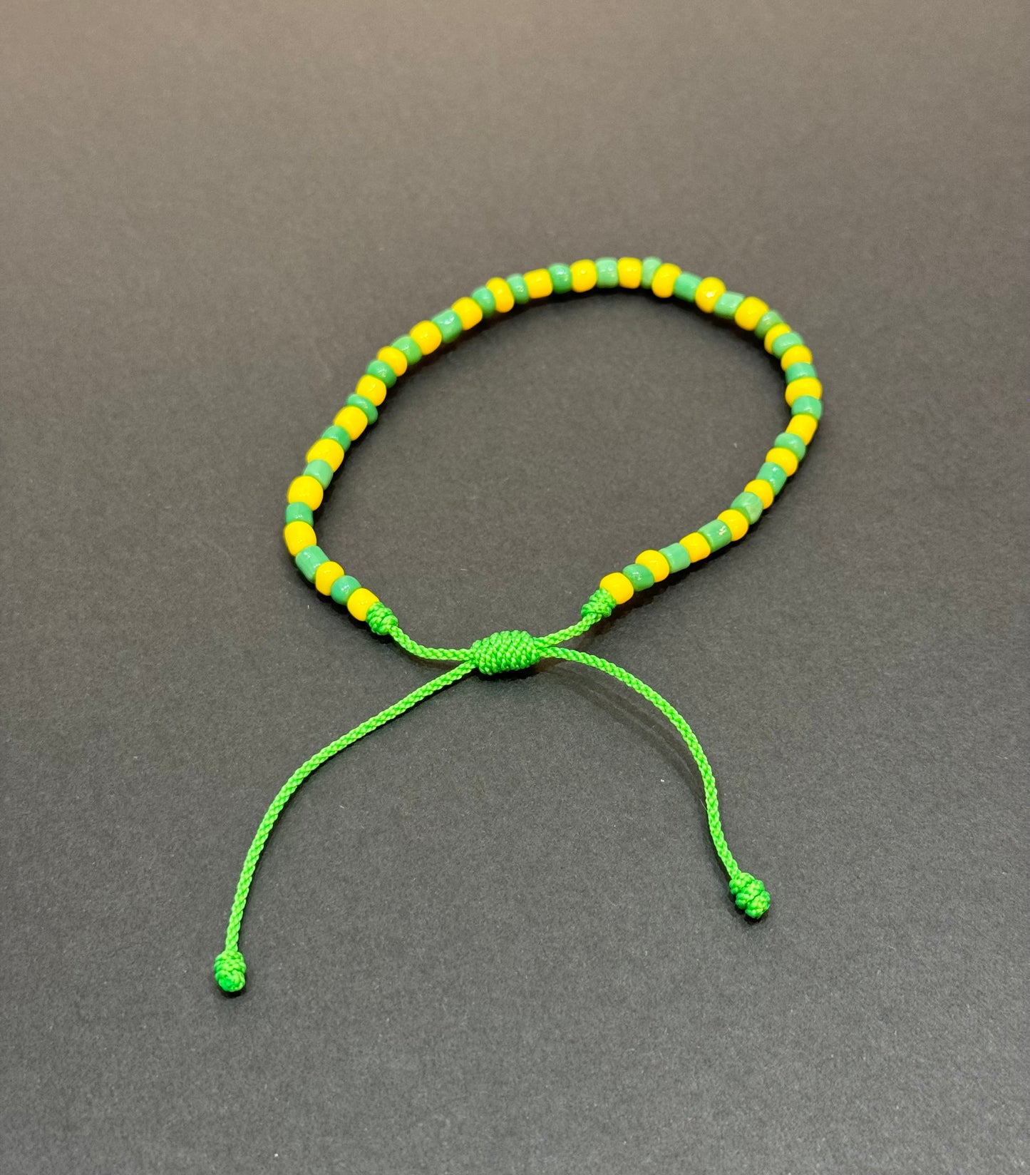 Orisha Orúla Handmade Beaded Pull String Green and Yellow Bracelet